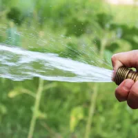 person with water hose